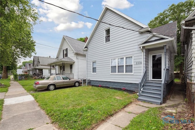 2336 Caledonia St, Toledo, OH 43605 - view of front of property with a front yard and entry steps