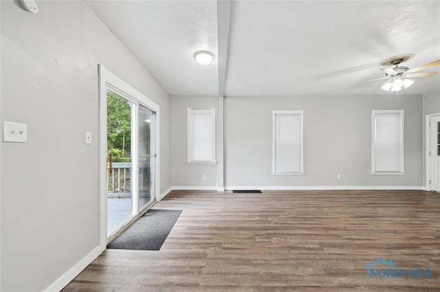 2336 Caledonia St, Toledo, OH 43605 - empty room featuring wood finished floors, ceiling fan, and a smoke detector