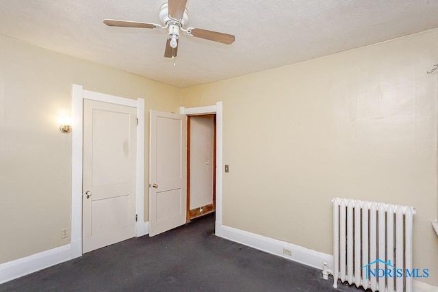 433 Islington St, Toledo, OH 43610 - empty room with radiator heating unit and ceiling fan