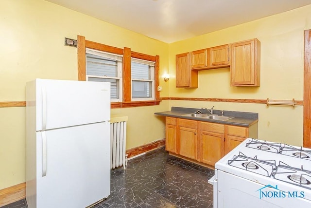 433 Islington St, Toledo, OH 43610 - kitchen with white appliances, dark marble finish flooring, and radiator