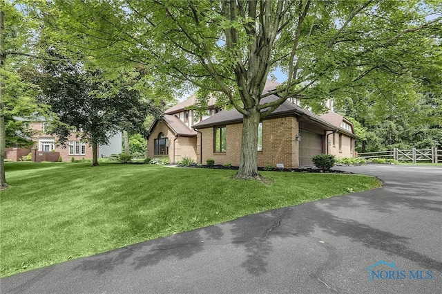 1626 Woodstream Rd, Perrysburg, OH 43551 - view of front of property featuring an attached garage, driveway, and brick siding