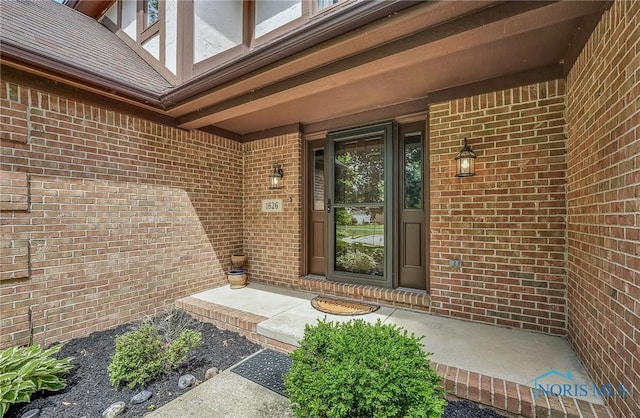 1626 Woodstream Rd, Perrysburg, OH 43551 - view of exterior entry with brick siding and a porch