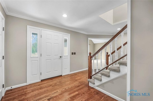 1626 Woodstream Rd, Perrysburg, OH 43551 - foyer entrance with ornamental molding, wood finished floors, stairs, and recessed lighting