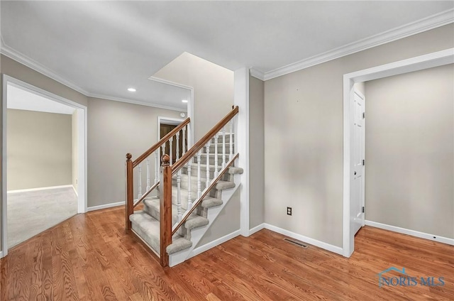 1626 Woodstream Rd, Perrysburg, OH 43551 - staircase featuring wood finished floors, crown molding, and recessed lighting
