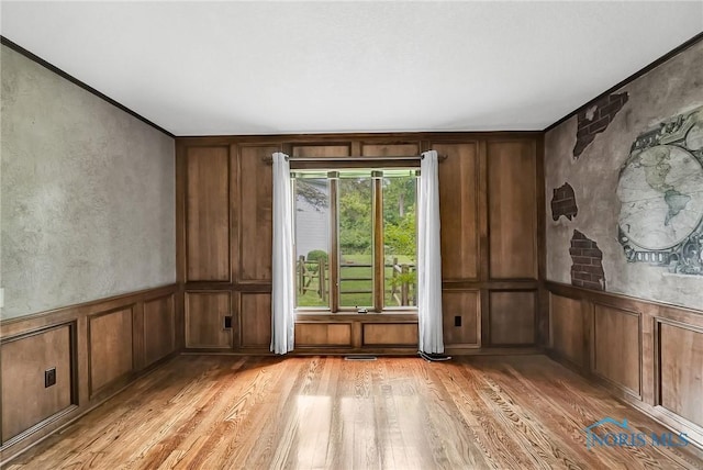 1626 Woodstream Rd, Perrysburg, OH 43551 - unfurnished room with a decorative wall and light wood finished floors