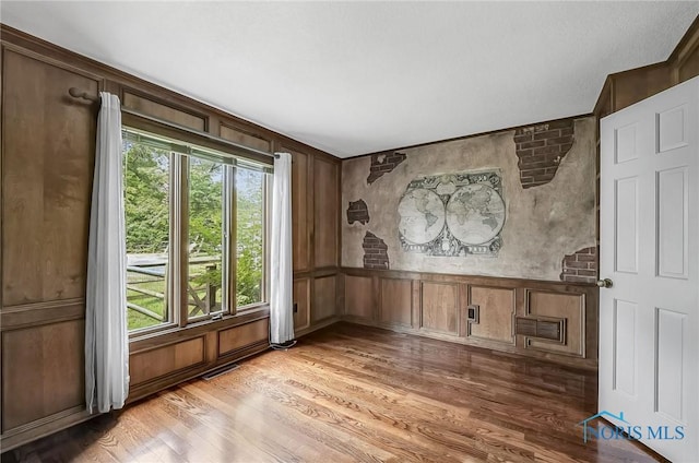 1626 Woodstream Rd, Perrysburg, OH 43551 - unfurnished office with light wood-type flooring and a decorative wall