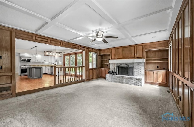 1626 Woodstream Rd, Perrysburg, OH 43551 - unfurnished living room featuring coffered ceiling, a ceiling fan, light colored carpet, a brick fireplace, and wooden walls