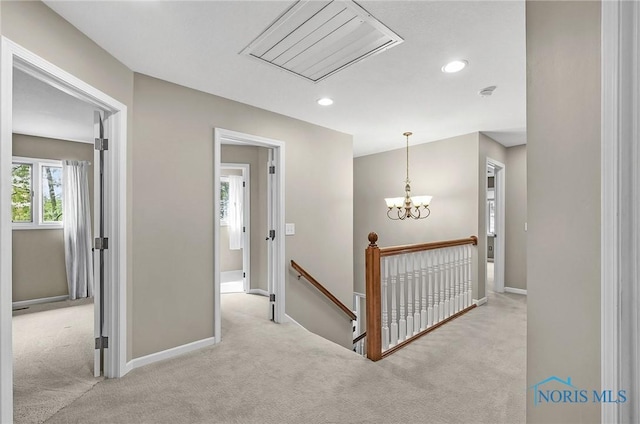 1626 Woodstream Rd, Perrysburg, OH 43551 - hall with an upstairs landing, carpet floors, recessed lighting, attic access, and a chandelier