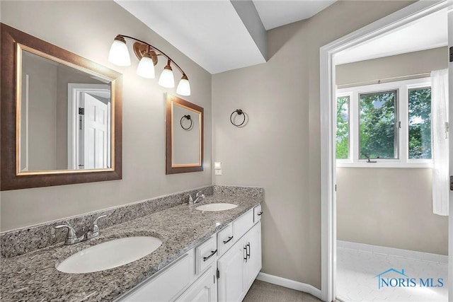 1626 Woodstream Rd, Perrysburg, OH 43551 - bathroom featuring double vanity and baseboards