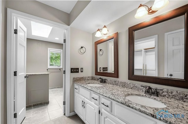 1626 Woodstream Rd, Perrysburg, OH 43551 - full bath with a skylight, double vanity, and tile patterned floors