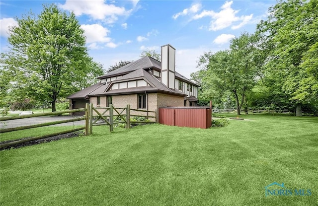 1626 Woodstream Rd, Perrysburg, OH 43551 - back of house with brick siding and a chimney