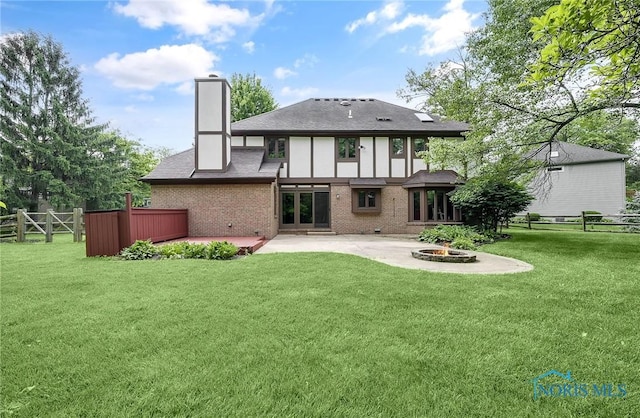 1626 Woodstream Rd, Perrysburg, OH 43551 - rear view of house with a fire pit, a chimney, a patio, a fenced backyard, and brick siding