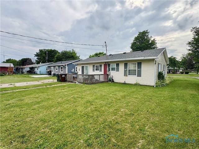 43 Longfellow Dr, Tiffin, OH 44883 - view of front of home with a front lawn and a deck