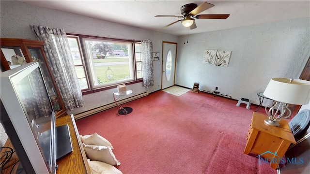 43 Longfellow Dr, Tiffin, OH 44883 - carpeted living room with baseboard heating, a textured wall, and ceiling fan
