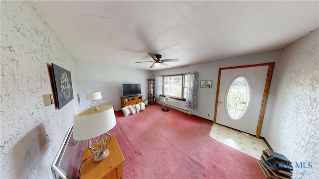 43 Longfellow Dr, Tiffin, OH 44883 - entryway featuring ceiling fan, a textured wall, and carpet floors