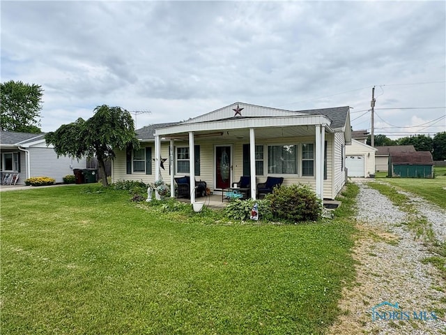 43 Longfellow Dr, Tiffin, OH 44883 - view of front of house featuring covered porch and a front lawn