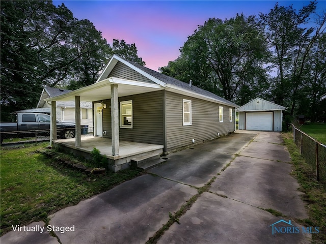5161 Langham Dr, Sylvania, OH 43560 - view of property exterior featuring a porch, an outbuilding, a detached garage, and concrete driveway