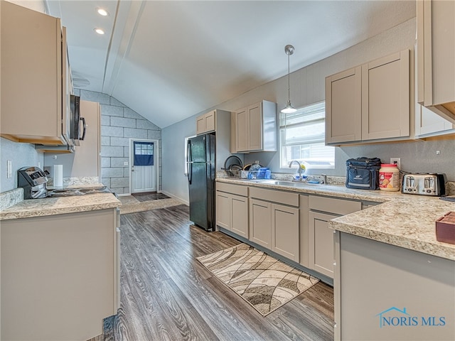 5161 Langham Dr, Sylvania, OH 43560 - kitchen featuring freestanding refrigerator, wood finished floors, light countertops, lofted ceiling, and range