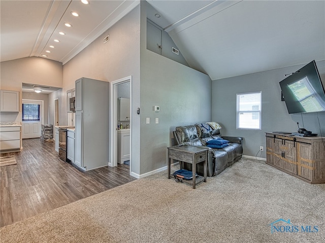 5161 Langham Dr, Sylvania, OH 43560 - living room with recessed lighting, carpet floors, wood finished floors, and high vaulted ceiling