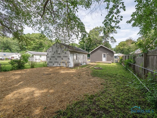 5161 Langham Dr, Sylvania, OH 43560 - back of property with a fenced backyard and an outdoor structure