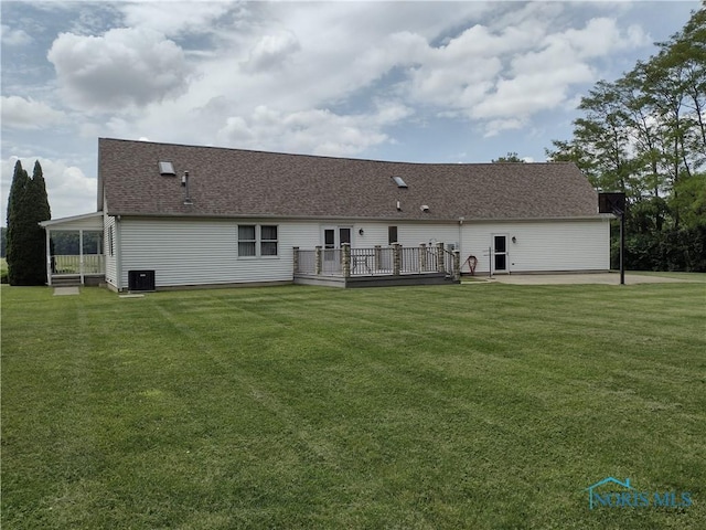 11550 County Road 26th 1, Fayette, OH 43521 - rear view of house featuring a wooden deck, a patio, a yard, and roof with shingles