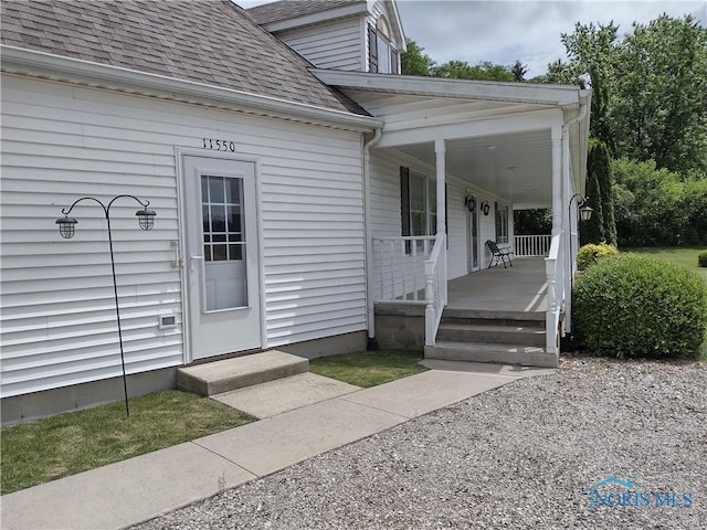 11550 County Road 26th 1, Fayette, OH 43521 - view of exterior entry with a shingled roof and a porch