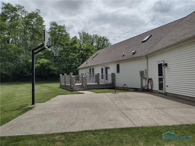 11550 County Road 26th 1, Fayette, OH 43521 - rear view of property with a patio area, a deck, a yard, roof with shingles, and view of scattered trees