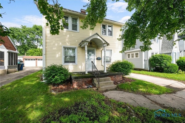 4128 Douglas Rd, Toledo, OH 43613 - view of front of home with an outdoor structure and a detached garage