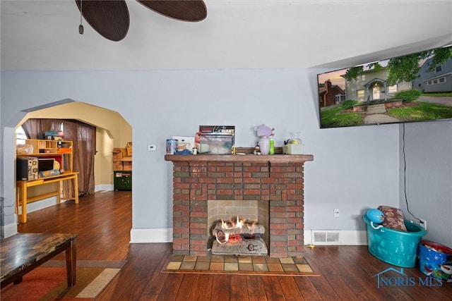 4128 Douglas Rd, Toledo, OH 43613 - living room featuring hardwood / wood-style flooring, a brick fireplace, and a ceiling fan
