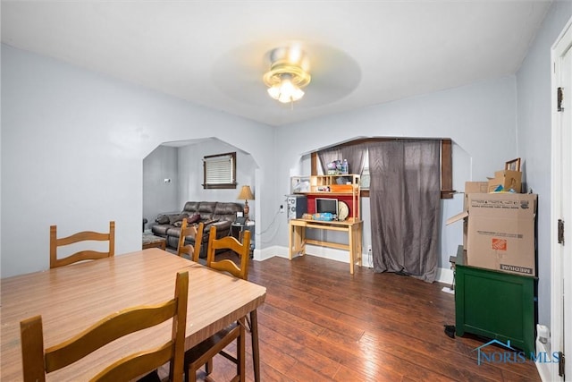 4128 Douglas Rd, Toledo, OH 43613 - dining room featuring ceiling fan, hardwood / wood-style floors, and arched walkways
