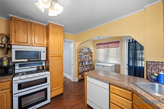 4128 Douglas Rd, Toledo, OH 43613 - kitchen featuring white appliances, ornamental molding, dark wood-type flooring, and brown cabinets