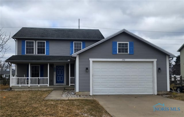 1731 Waterford Dr, Bowling Green, OH 43402 - view of front of property with a porch, concrete driveway, and a garage