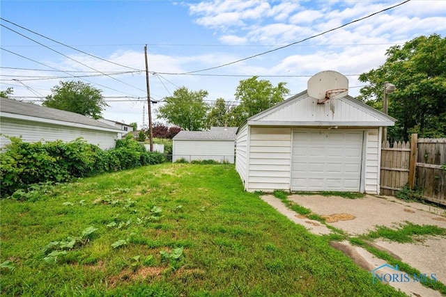 42 California Blvd, Toledo, OH 43612 - view of yard with a detached garage, an outdoor structure, and driveway