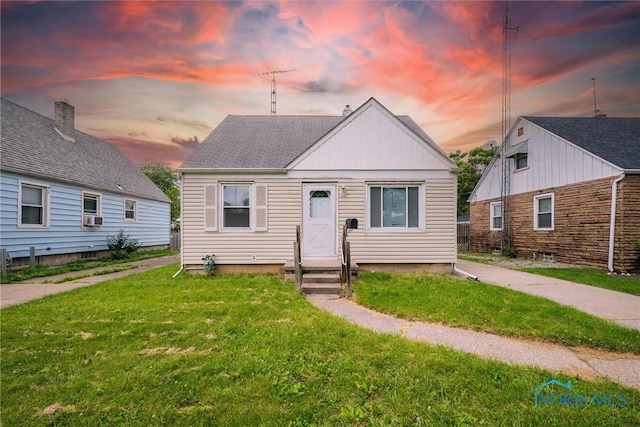 42 California Blvd, Toledo, OH 43612 - bungalow-style house with entry steps, a front yard, cooling unit, and board and batten siding