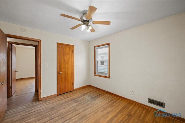 42 California Blvd, Toledo, OH 43612 - unfurnished bedroom featuring wood finished floors, a closet, and ceiling fan