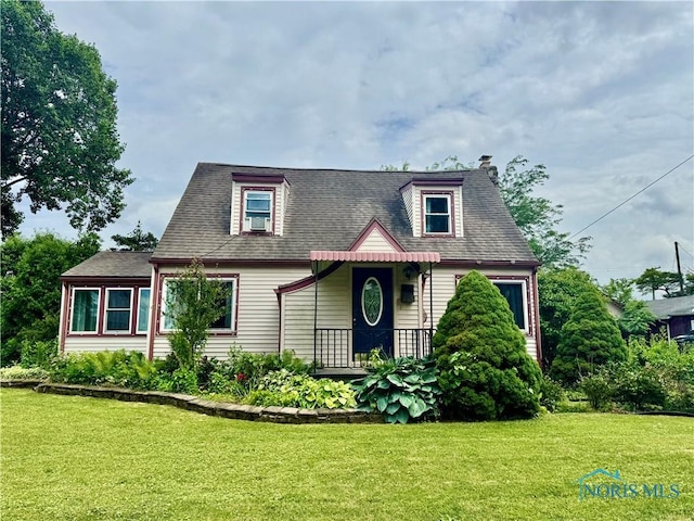 908 E High St, Hicksville, OH 43526 - view of front of house with a front yard and a shingled roof