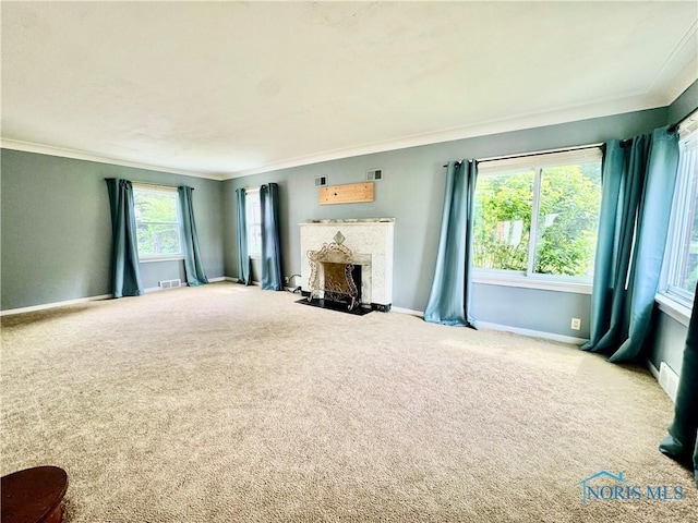 908 E High St, Hicksville, OH 43526 - unfurnished living room with ornamental molding, a fireplace, and carpet flooring