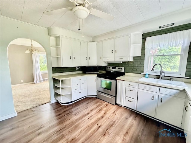 908 E High St, Hicksville, OH 43526 - kitchen featuring open shelves, stainless steel electric range, white cabinetry, and a chandelier