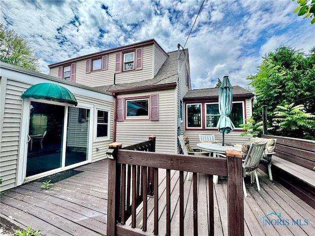 908 E High St, Hicksville, OH 43526 - wooden terrace with outdoor dining space
