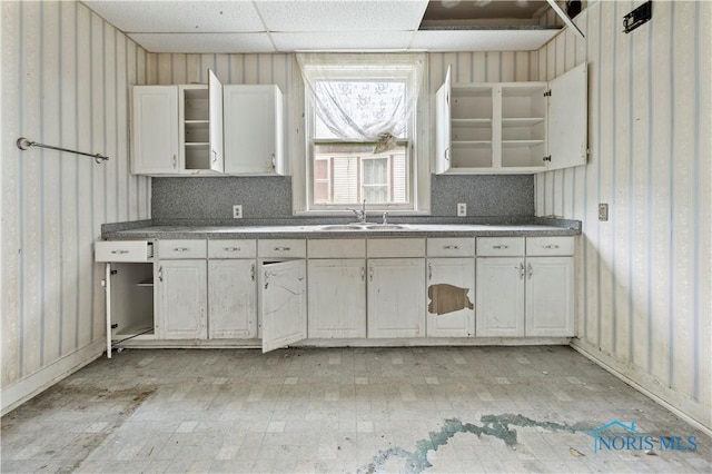 2360 Maplewood Ave, Toledo, OH 43620 - kitchen with open shelves, white cabinetry, and backsplash