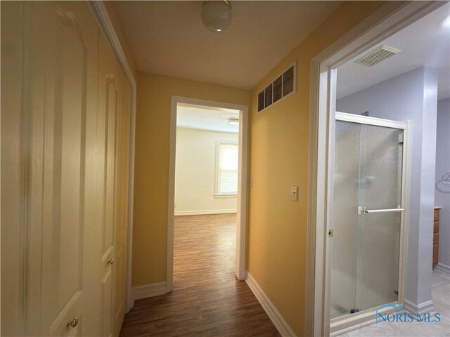 1007 Leonard Ct, Fostoria, OH 44830 - hallway with wood finished floors and baseboards