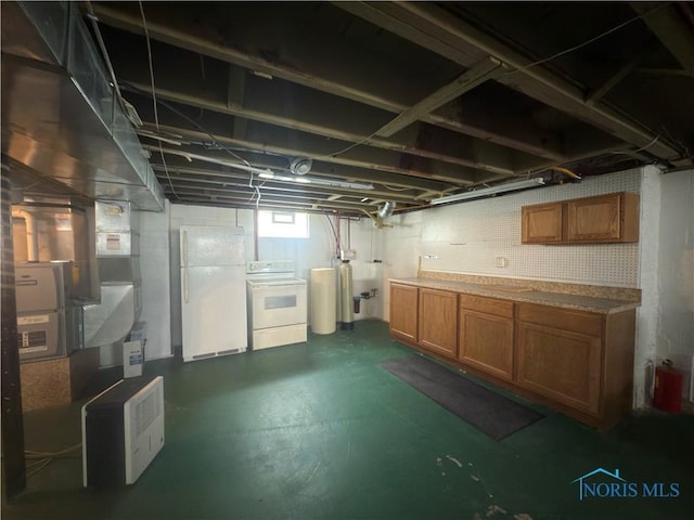 1007 Leonard Ct, Fostoria, OH 44830 - basement with freestanding refrigerator, a water softener system, and separate washer and dryer
