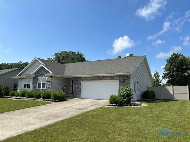 2440 Bluestone Dr, Findlay, OH 45840 - view of front of property with stone siding, an attached garage, and concrete driveway
