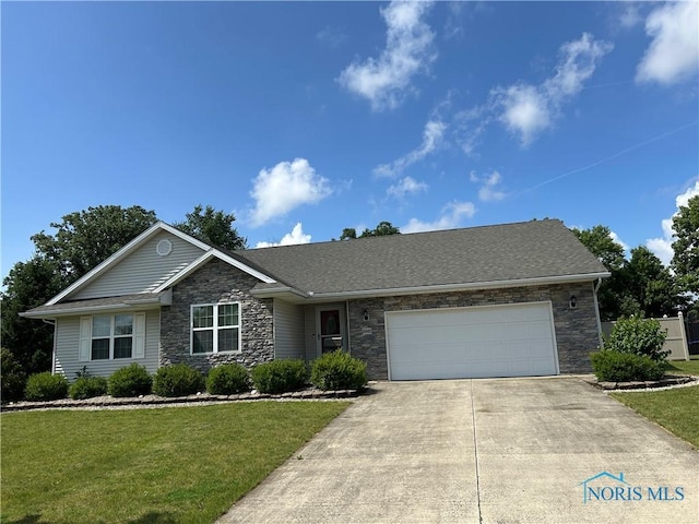 2440 Bluestone Dr, Findlay, OH 45840 - view of front of home with stone siding, driveway, an attached garage, and a front yard