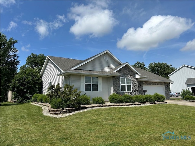2440 Bluestone Dr, Findlay, OH 45840 - view of front of home with a garage, a front yard, concrete driveway, and stone siding
