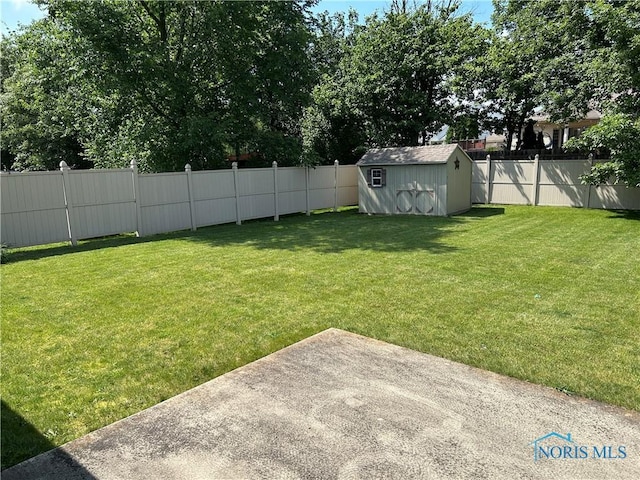 2440 Bluestone Dr, Findlay, OH 45840 - fenced backyard featuring a storage shed and a patio