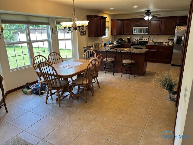2440 Bluestone Dr, Findlay, OH 45840 - dining room with a chandelier, light tile patterned floors, recessed lighting, and ceiling fan