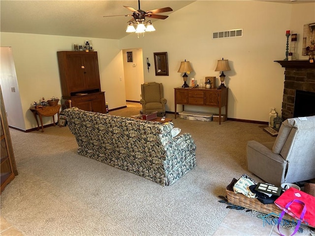 2440 Bluestone Dr, Findlay, OH 45840 - living room with light colored carpet, ceiling fan, vaulted ceiling, and a fireplace