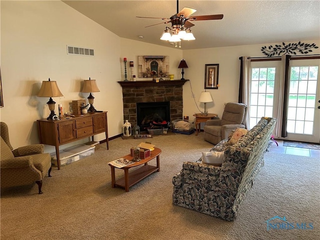 2440 Bluestone Dr, Findlay, OH 45840 - living area with carpet, ceiling fan, a stone fireplace, and lofted ceiling
