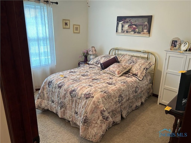 2440 Bluestone Dr, Findlay, OH 45840 - carpeted bedroom with multiple windows